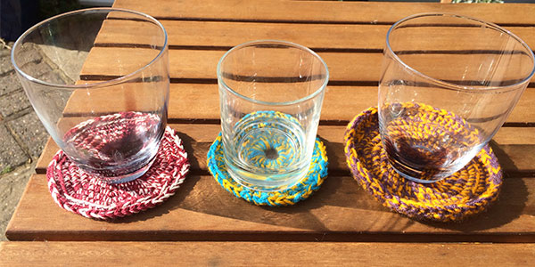 photo showing three simple crochet coaster designs