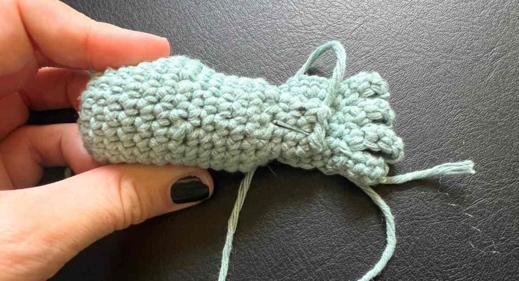 sewing crochet frog hands