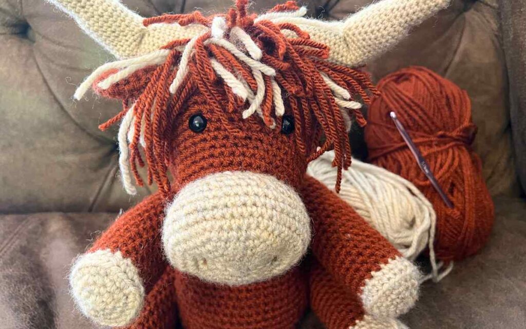 sewing the highland cow together