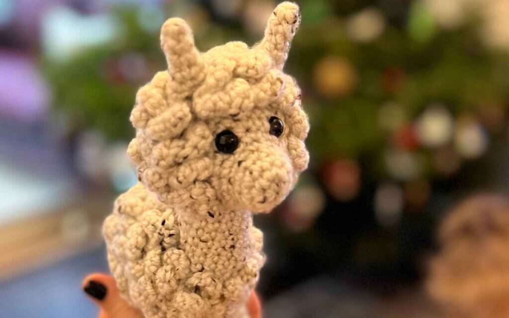 crocheting an amigurumi alpaca