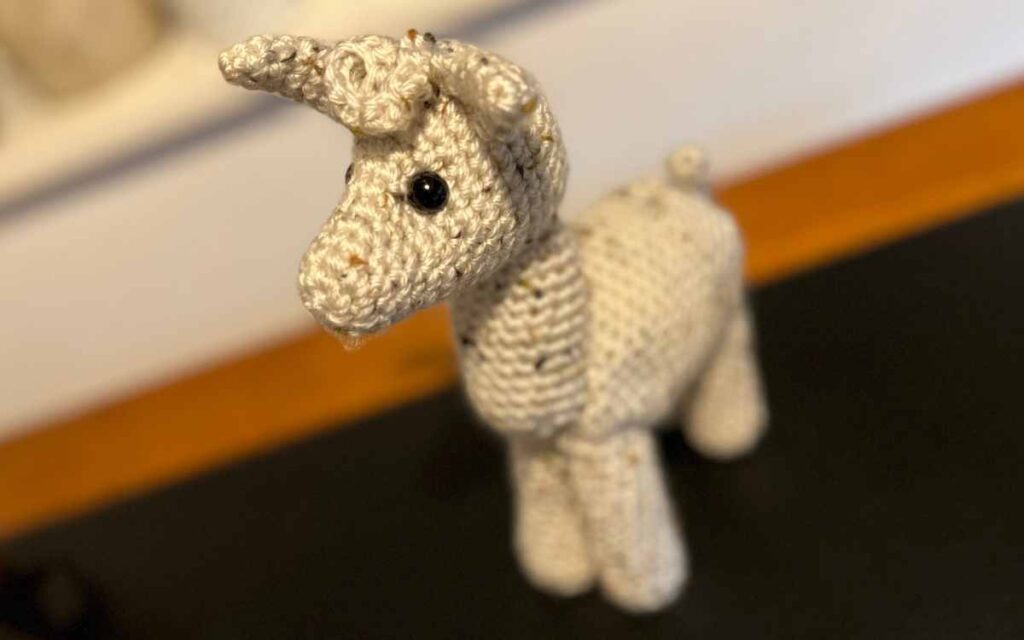 an image showing a crochet llama toy