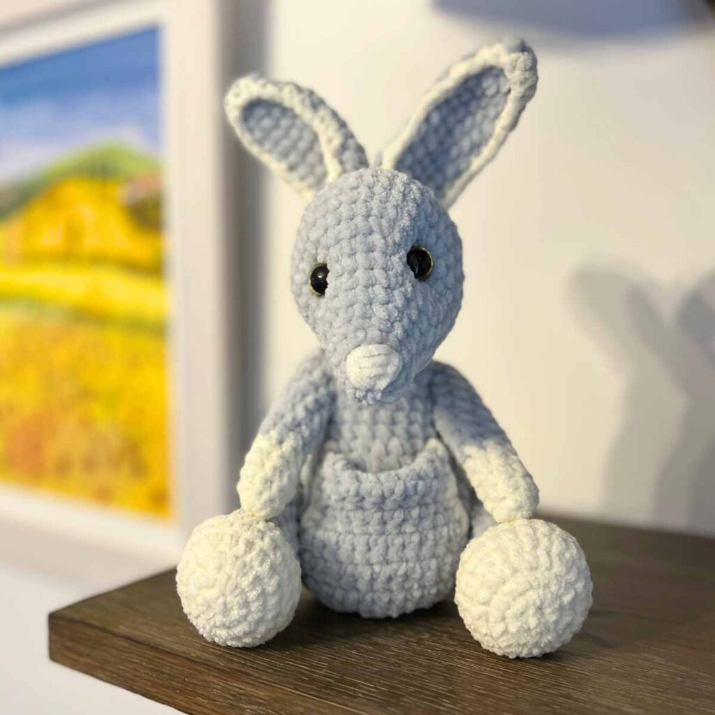 image of the crochet wallaby sitting on a shelf