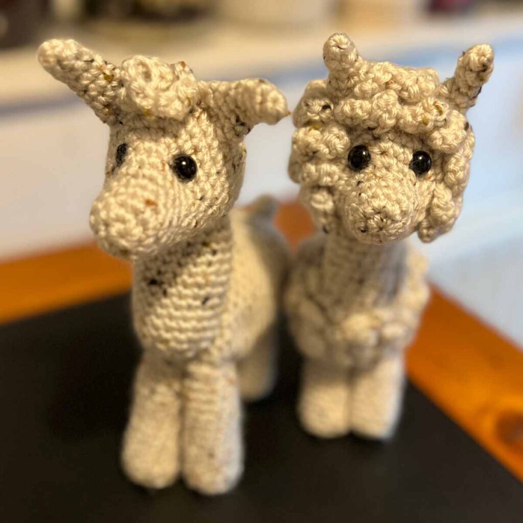 a photo of a llama and alpaca crochet