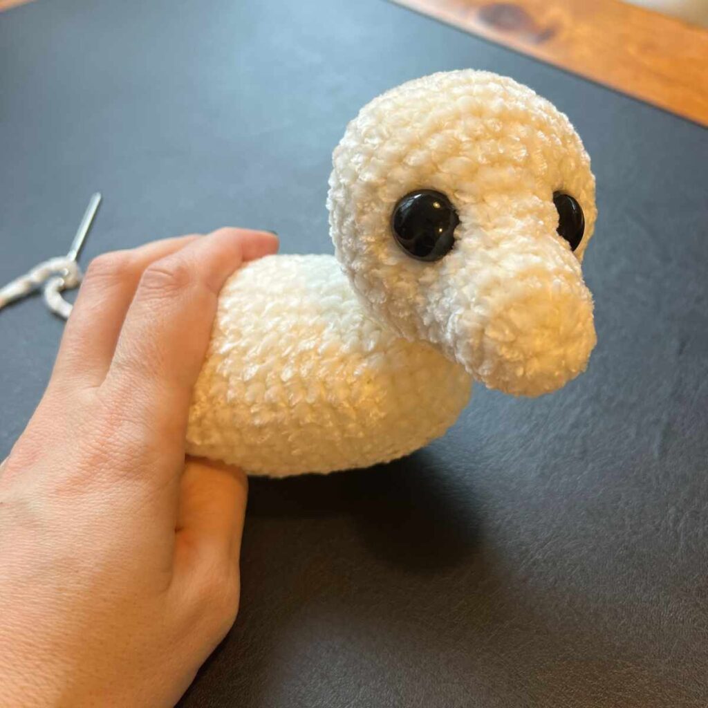image of a crochet polar bear cub body