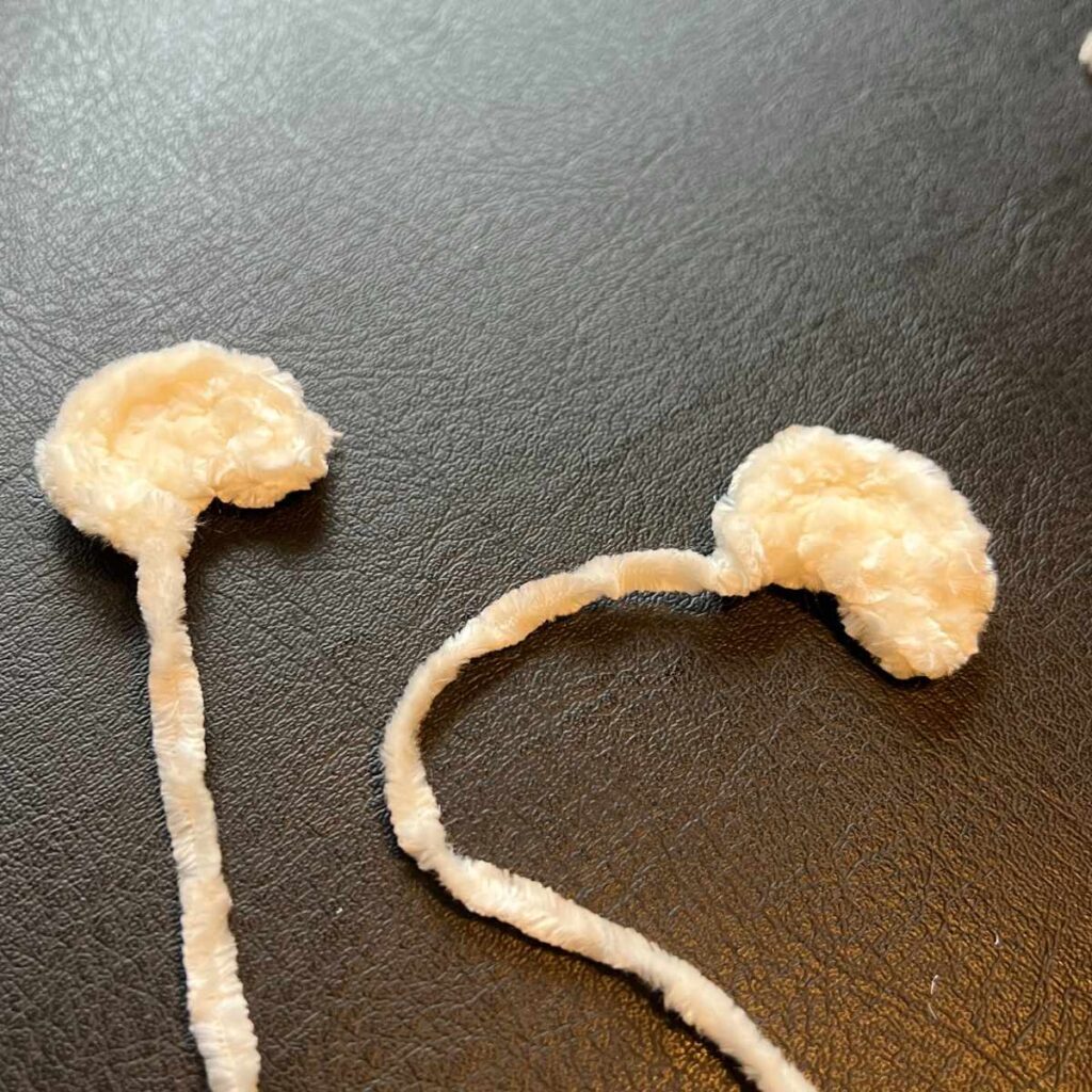 image of a crochet polar bear cubs ears