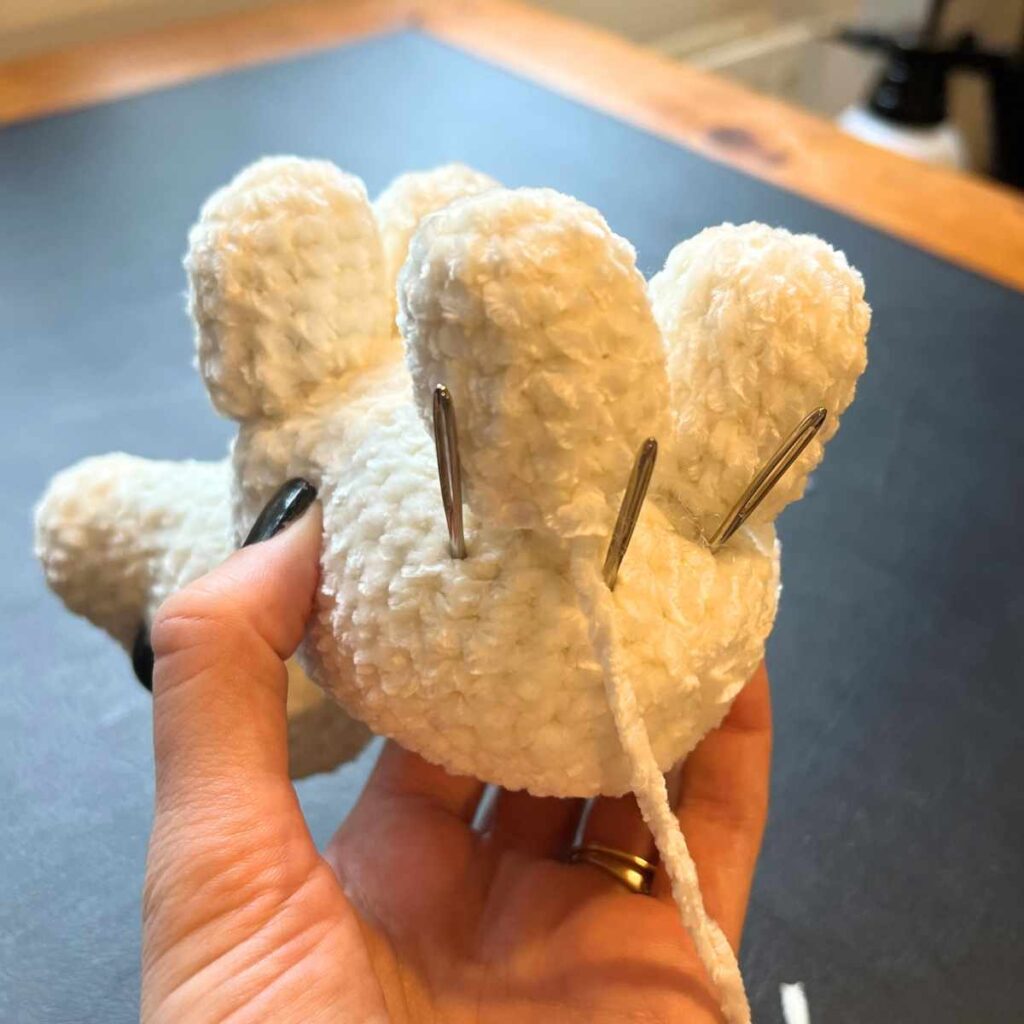 image of a crochet polar bear cub legs