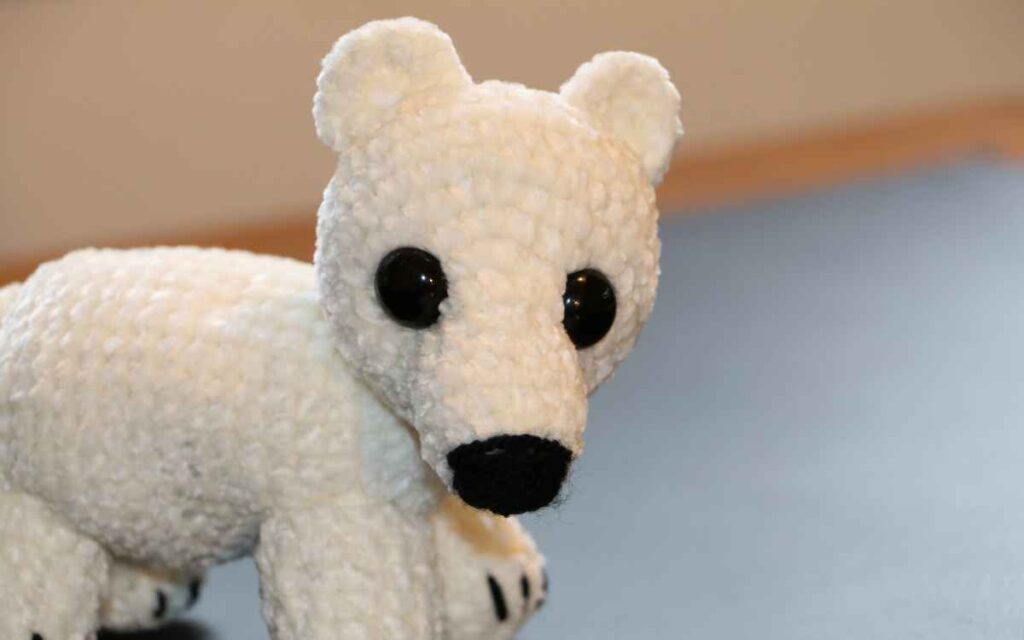 image of a crochet polar bear cub