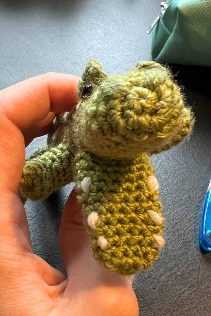 photo showing the crochet crocodile's sewn teeth and nostrils