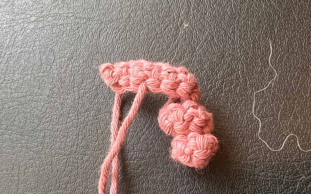 image showing my crochet piglet's tail being constructed