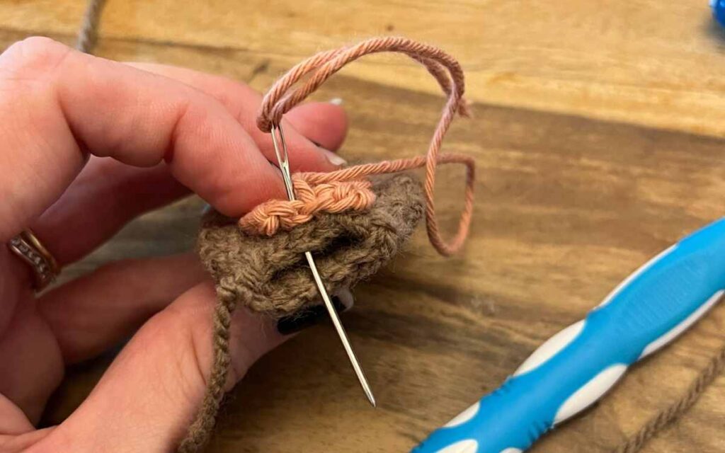 image showing me sewing crochet rabbit ears 