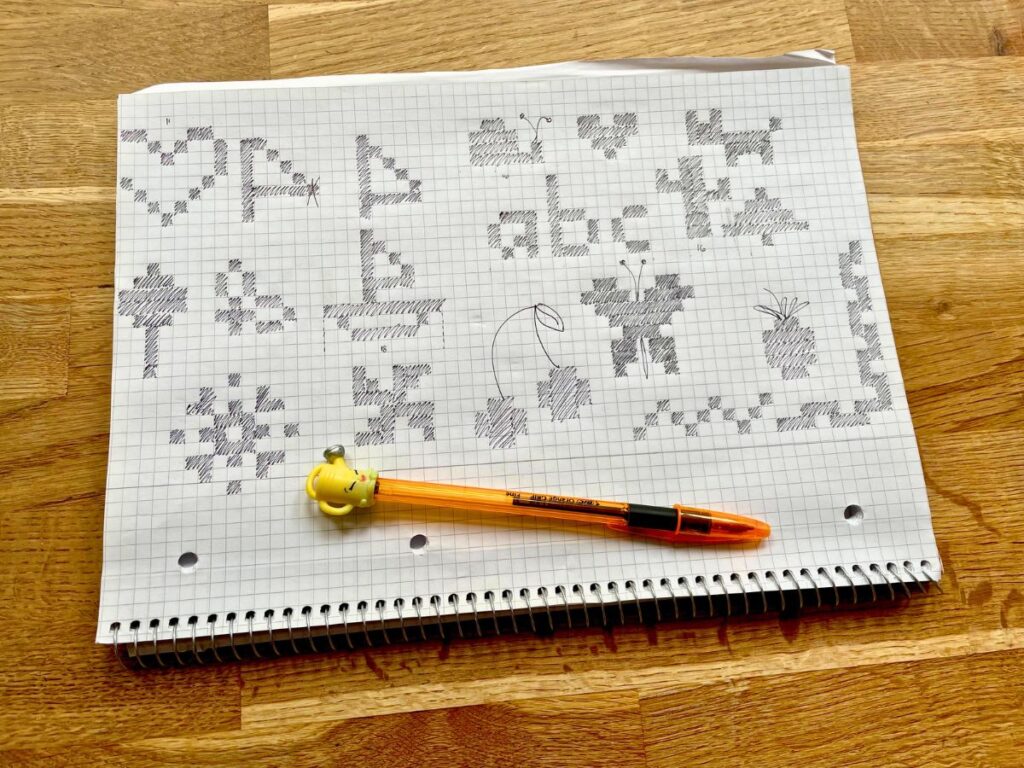 brainstorming bobble stitch motifs on square paper