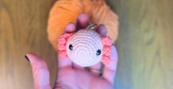 picture of the amigurumi axolotl keychain in my hand