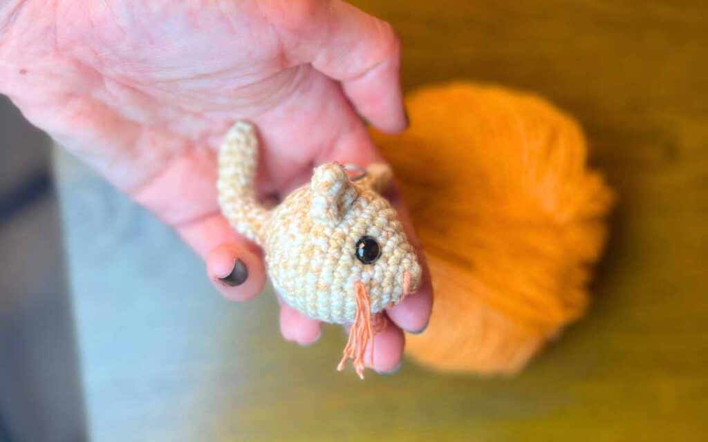 picture of my amigurumi kitten keychain from the side
