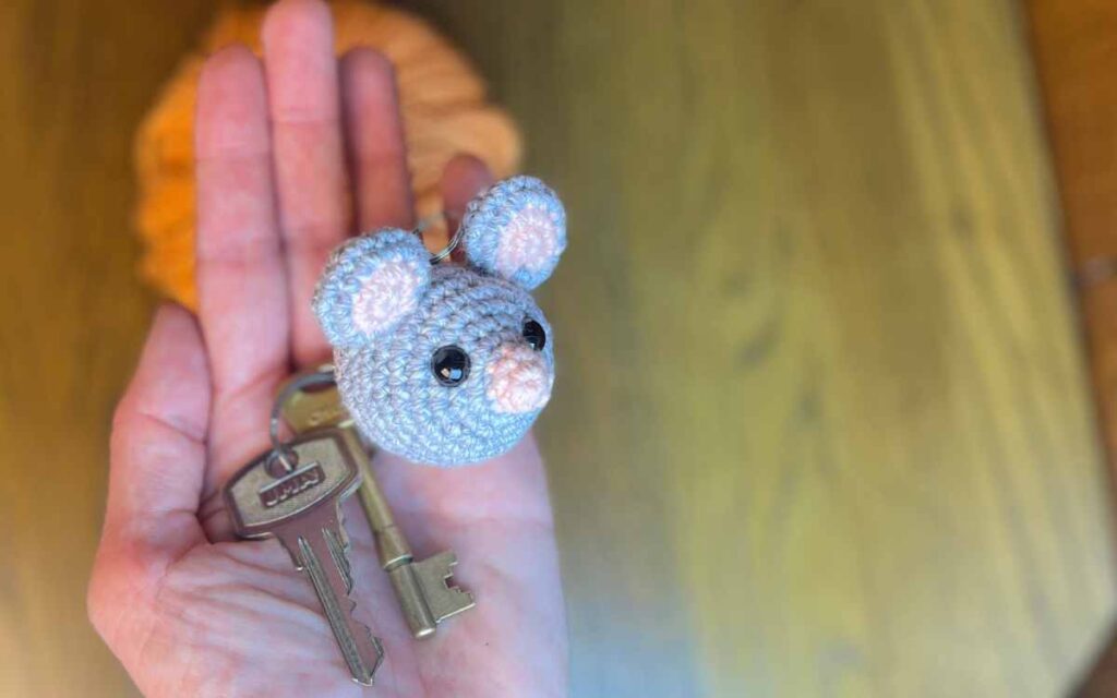 image of my crochet mouse keychain in my hand