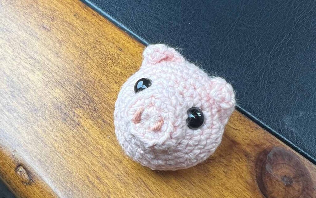 image of my crochet pig on the desk