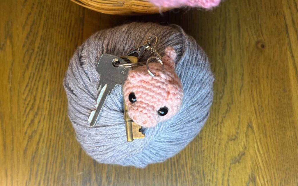 top view image of the crochet pig showing it's little tail