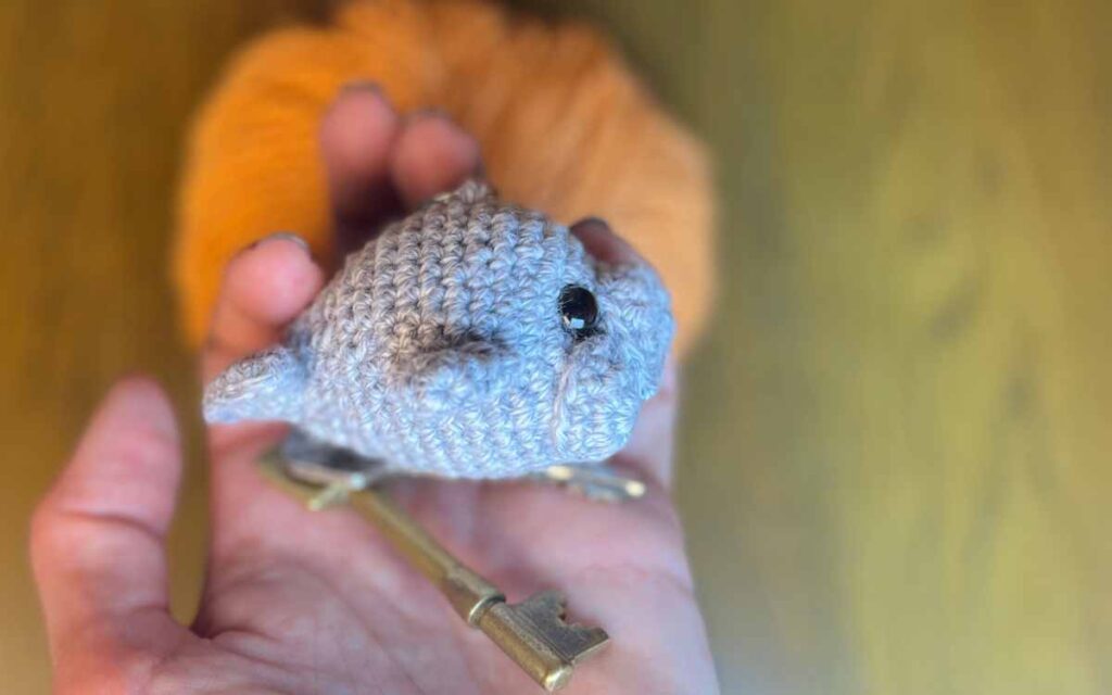 photo of my amigurumi seal keychain from the side