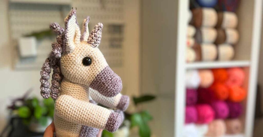 close up of crochet unicorn's head