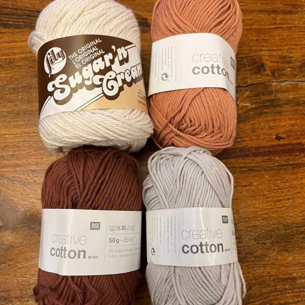 image showing 4 similar skeins of cotton yarn