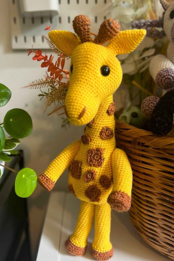 photo of the giraffe toy standing on my shelf