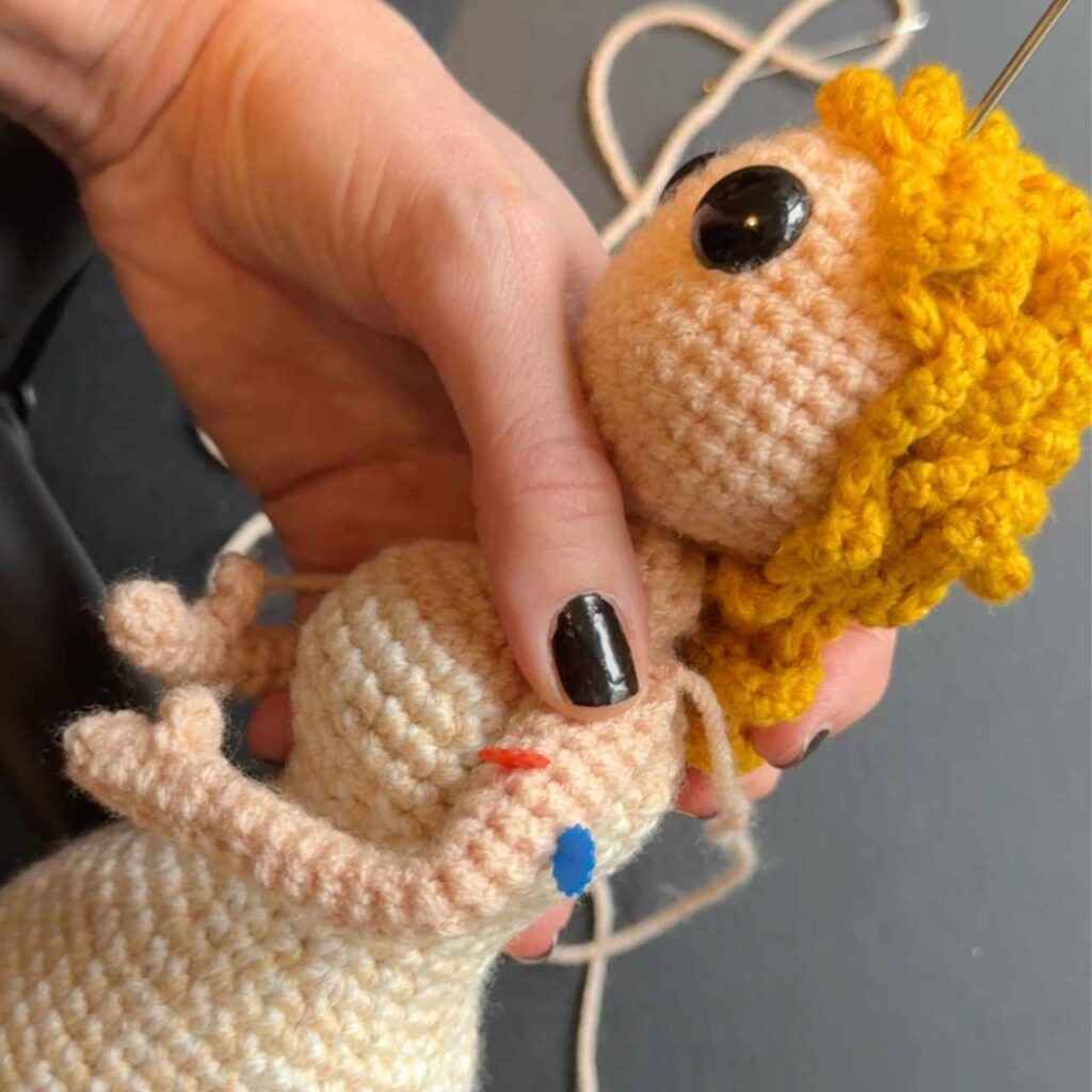 crochet doll pinned for sewing