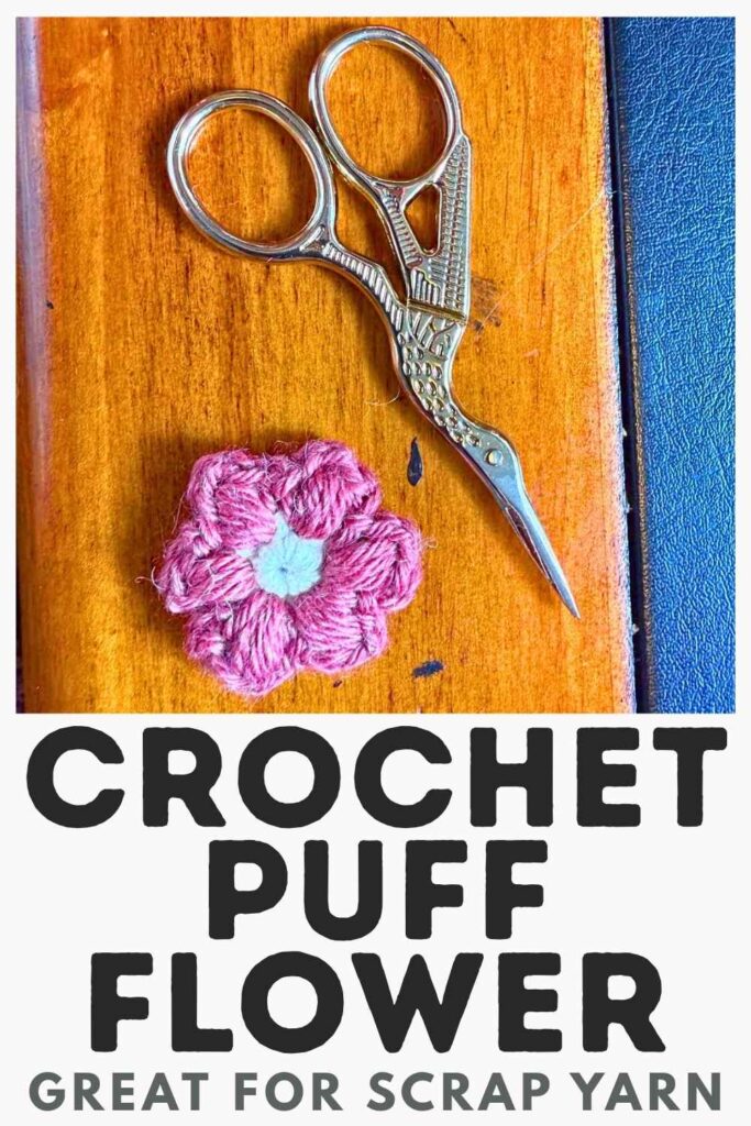 photo of a pair of scissors and a crochet puff flower