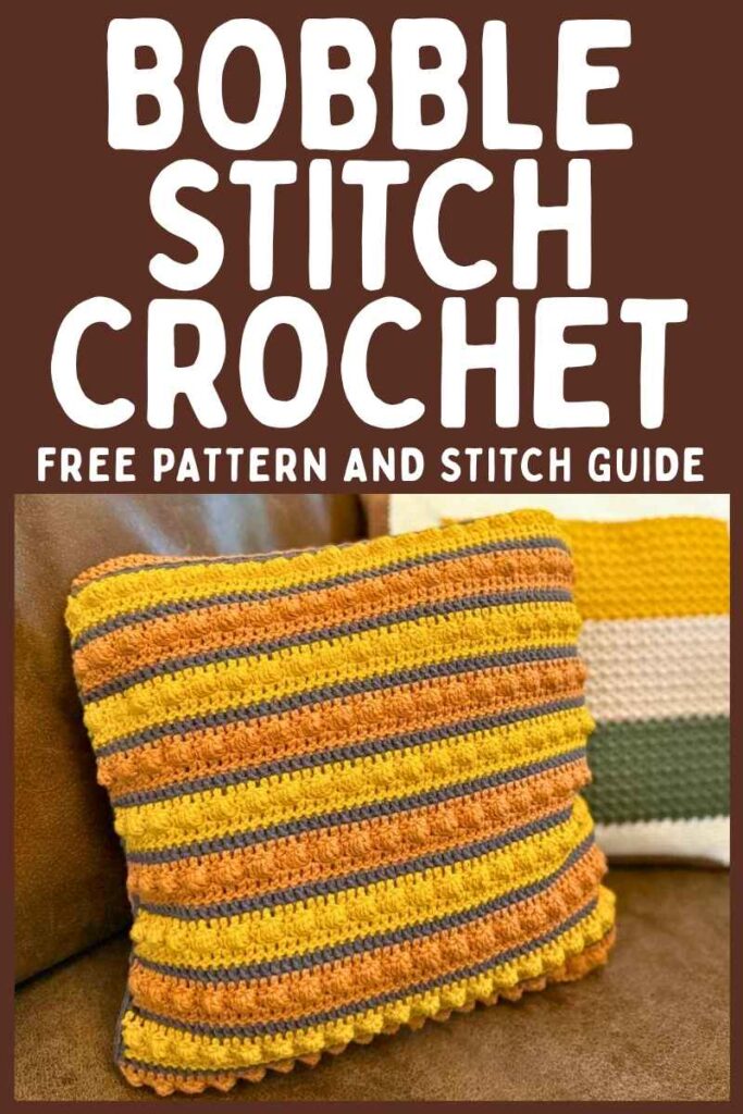 photo of a striped bobble stitch crochet throw pillow