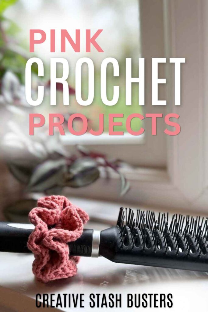 photo of a pink crochet scrunchie on a black hairbrush handle