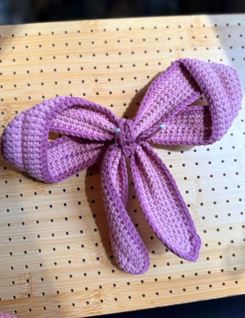 crochet bow on the blocking board
