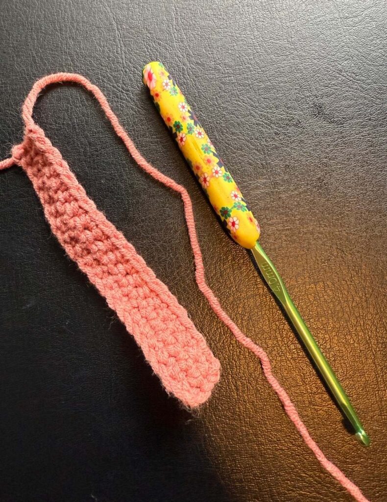 the central tie section next to a crochet hook