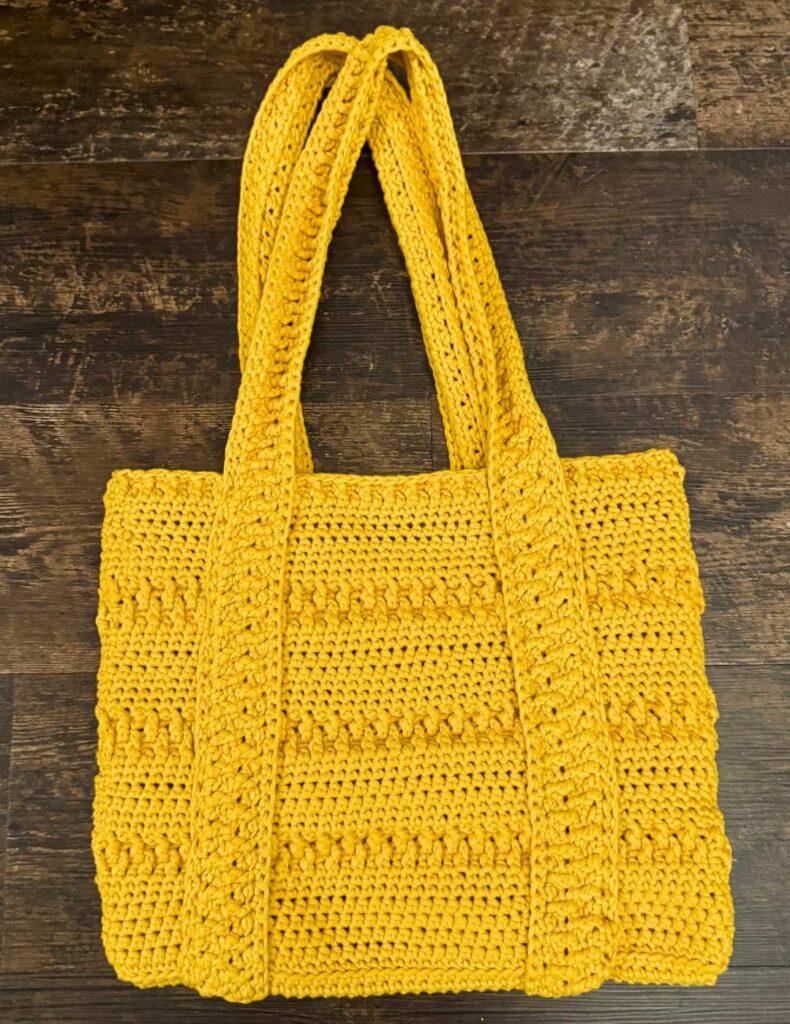crochet tote bag on the floor