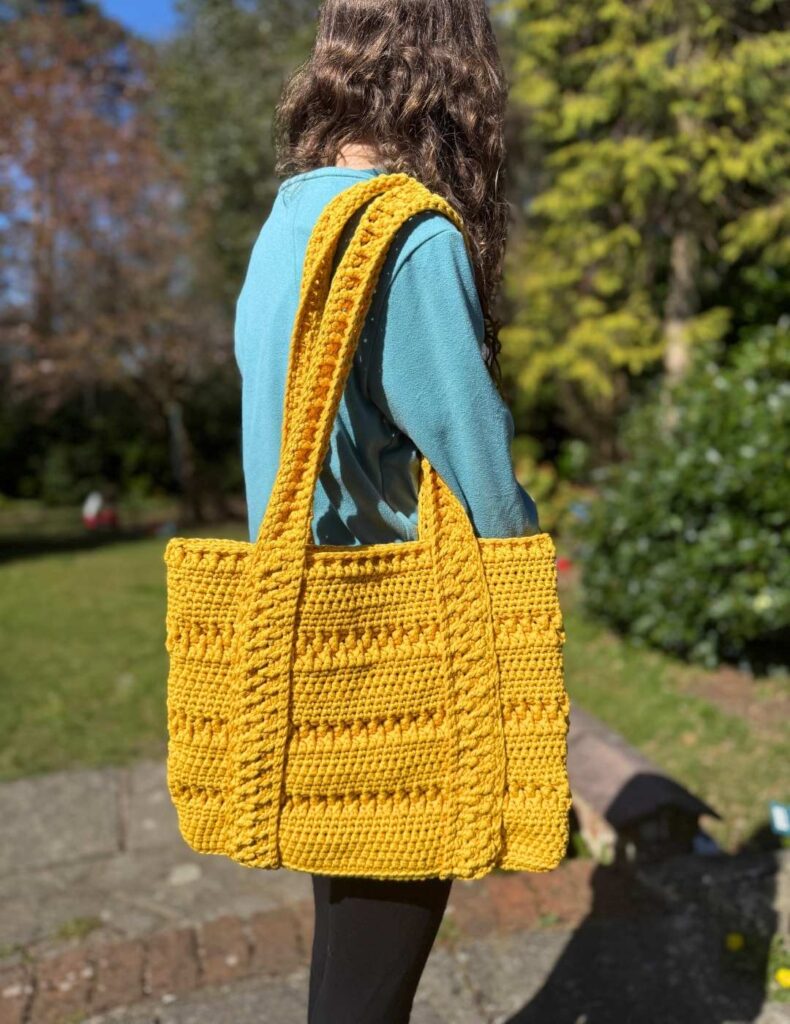 crochet tote bag on the shoulder