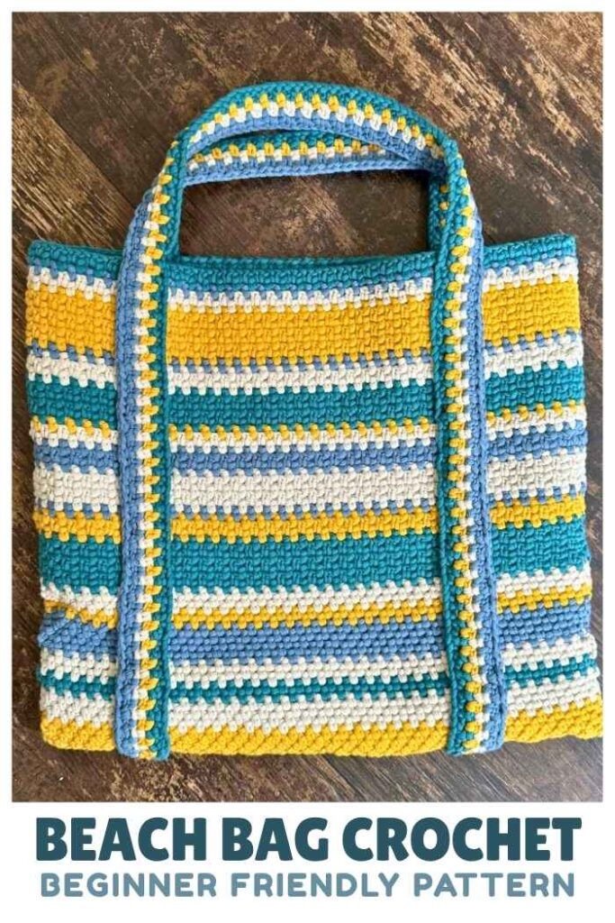 photo of a blue and yellow striped crochet beach bag on a wooden floor