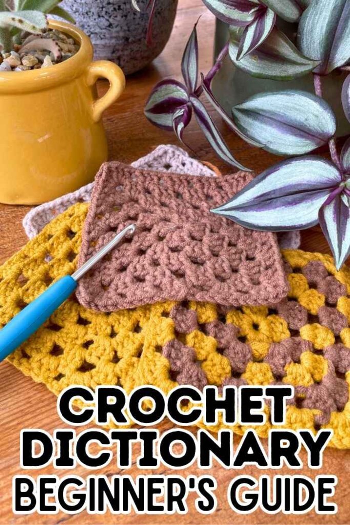 photo of some crochet squares and a crochet hook on a table next to a tradescantia plant and a kalanchoe