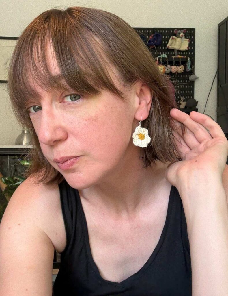 me wearing the earrings