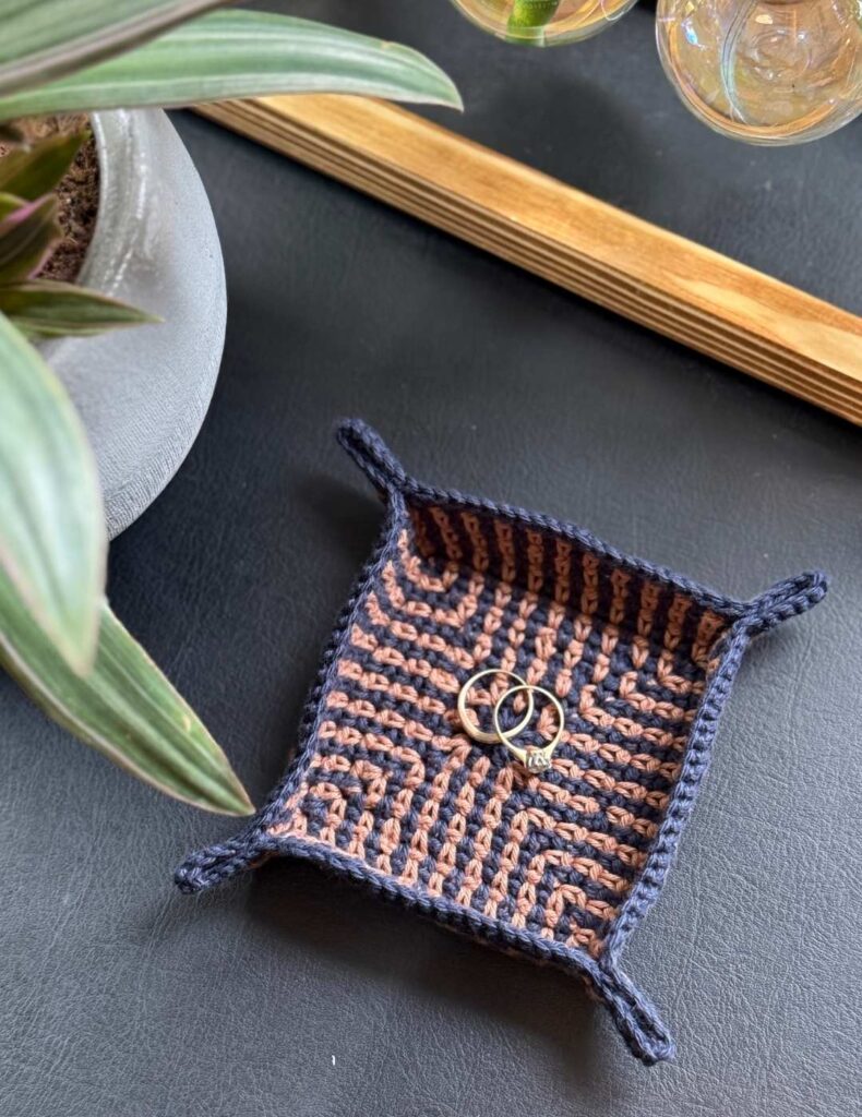 trinket tray beside a plant